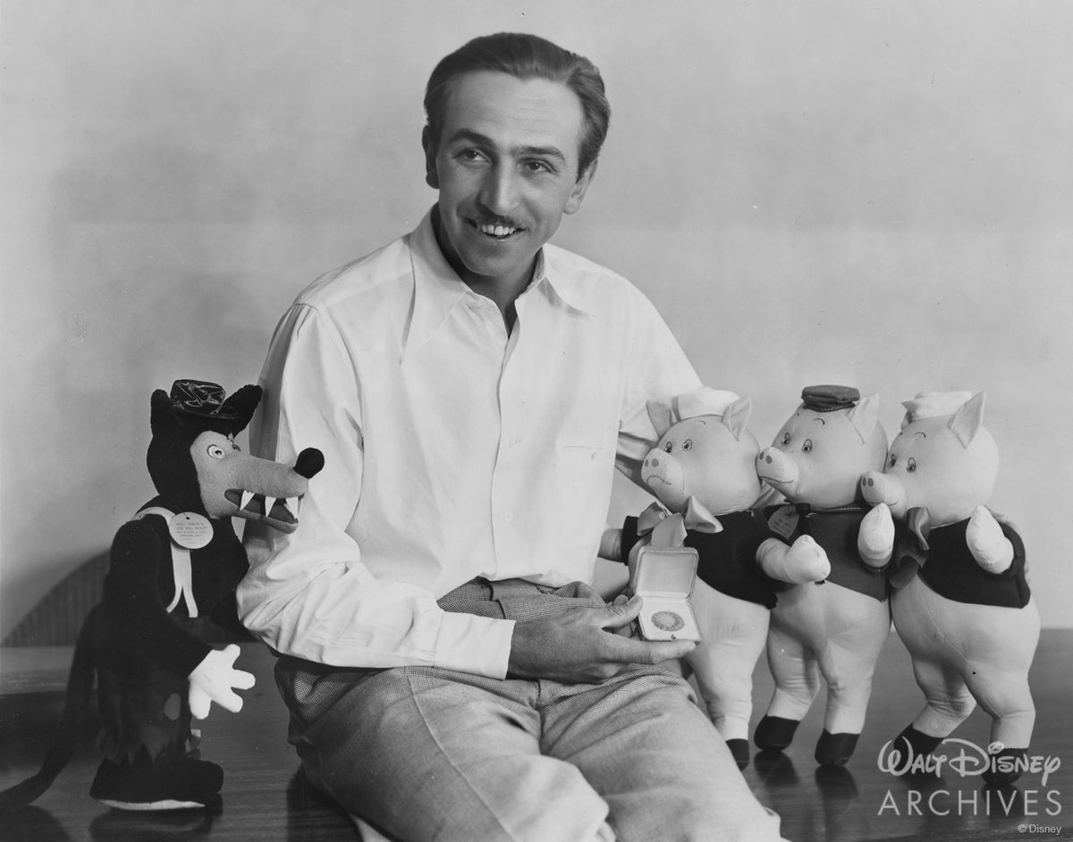 Today marks the 90th anniversary of #ThreeLittlePigs (1933)! Here, #WaltDisney poses with early dolls of the short’s breakout stars and holds a gold medal from New Movie Magazine, which praised the cartoon as one of the biggest film events of the year. #disney100 🐷 🐷 🐷 🐺