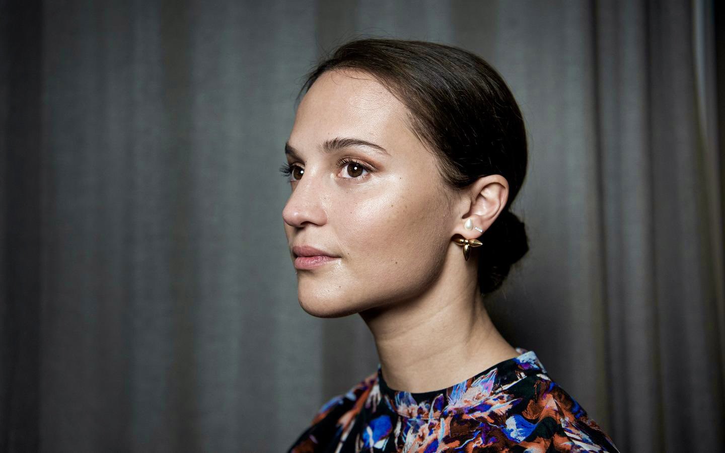 Alicia Vikander is every inch the doting mum as she enjoys a day