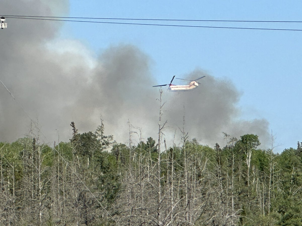 Wildfire burning west of Ely near Lucky Boy.  Chinook helicopter and Morse-Fall Lake fire battling. Lots of wind. Extreme fire conditions with low humidity.