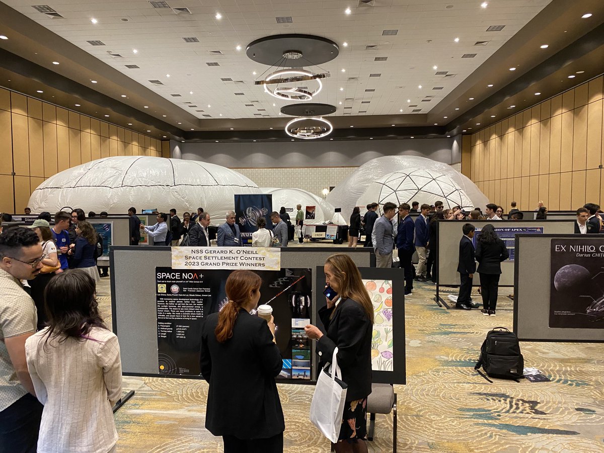 JohnJossy1957's tweet image. Brilliant young students display their inspirational #spacesettlement posters at ⁦@nss⁩ #ISDC2023 with Space Development Network’s Instabase display in the background.