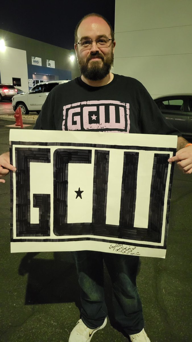 LVSignChick's tweet photo. A gift for @JohnGCWPodcast to keep on truckin' with his podcast! And for the record, it is #Sign34K! #FSWvsGCW https://t.co/A98eJVFegZ