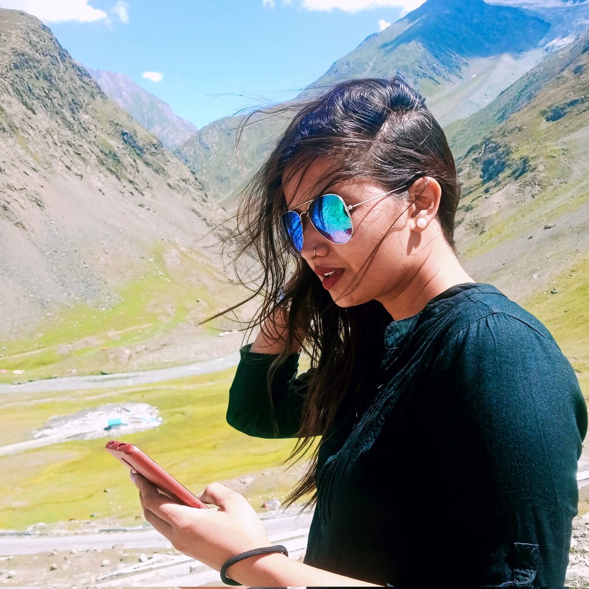 Sunshine and scrolling 🌞📱 This woman knows how to enjoy a beautiful day while staying connected. #TechSavvy #OnTheGo #SunglassesStyle #DigitalNomad #SocialMediaAddict #Drassvalley #Kargil
#NewProfilePic