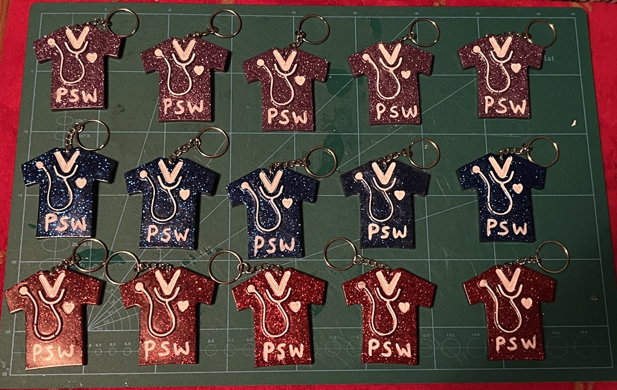 I made 15 PSW nurse shirts for a commission order I had gotten. They all turned out great 🤩❤️👩🏻‍⚕️ #resin #artresin #pswnurseshirts #art #create #glitter #commission #keychains #resinartist