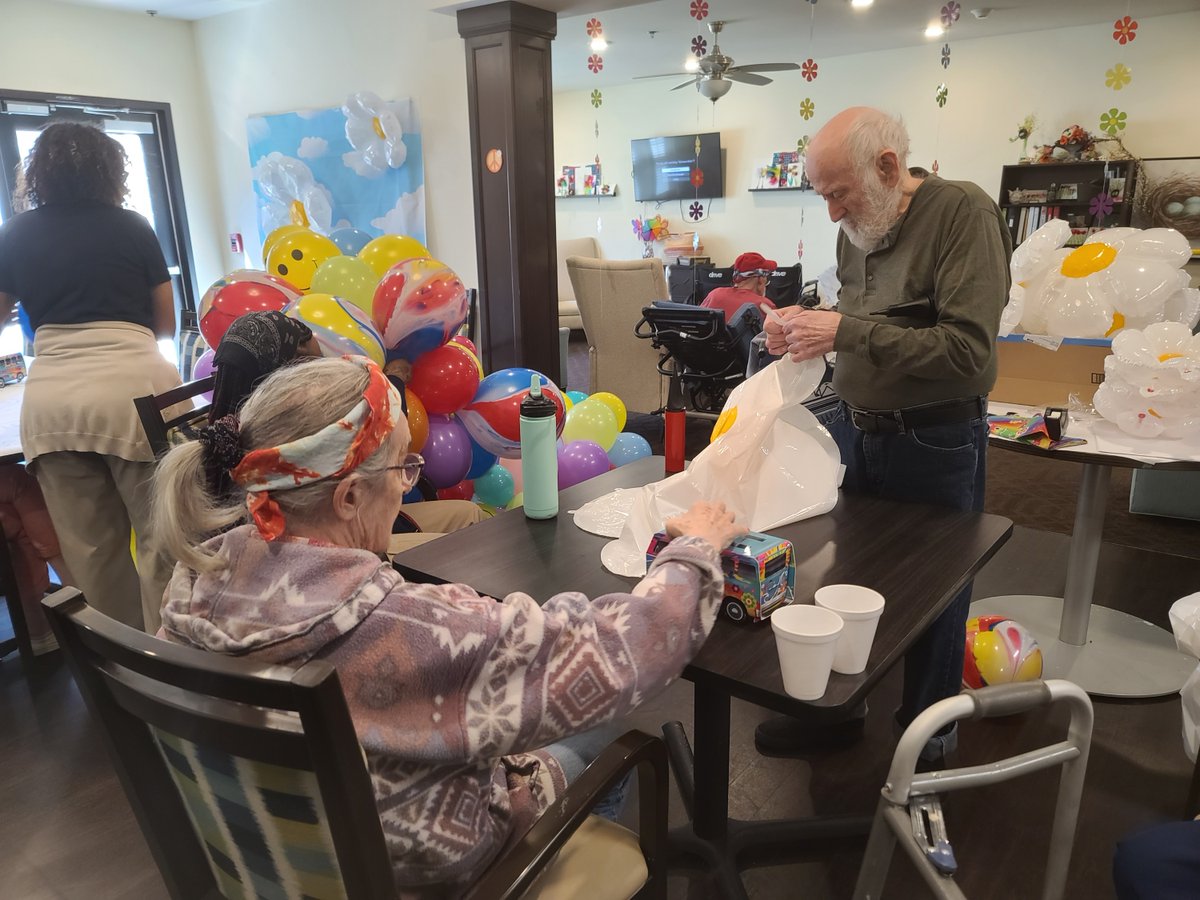 Legacy is getting ready for our Groovy Theme Dinner! Balloons are being blown, tables are becoming a work of art, all with the help of our residents and amazing staff members! 🎈 😃 🌈 ☮️ #TrilogyLiving #TrilogyThemeWeek #GroovinWithTrilogy #BFF