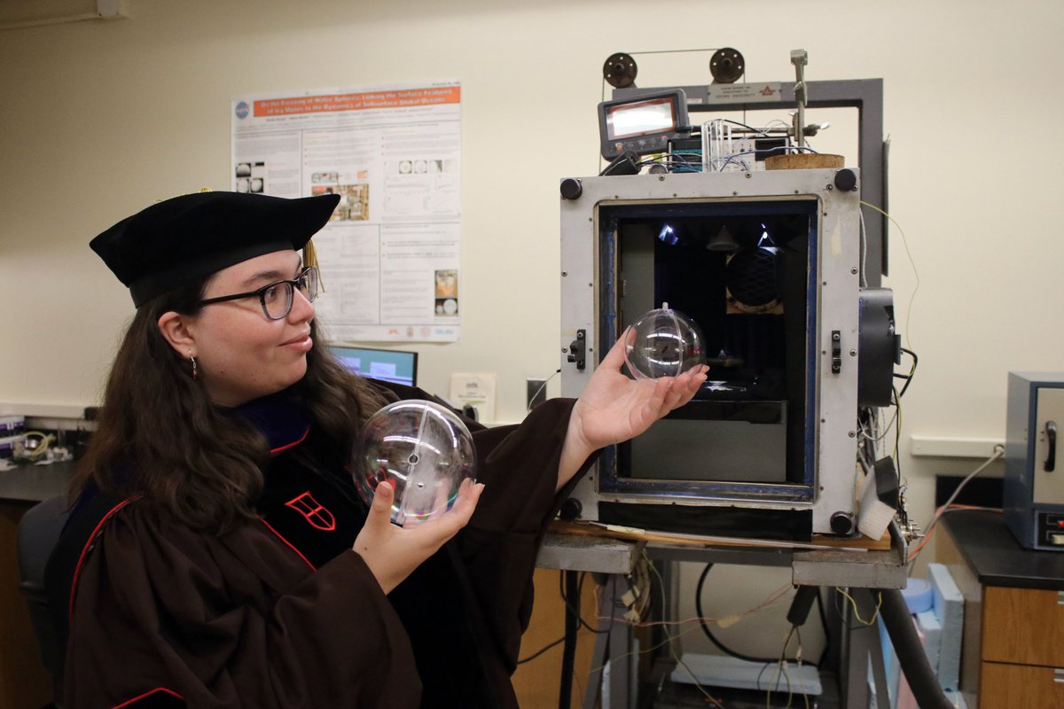 ThatEricaN's tweet photo. Wore a floppy hat, graduated, and couldn't resist taking a few silly photos by my freezing chamber for the ice spheres 🧊🎓 https://t.co/GYDE9UciwN