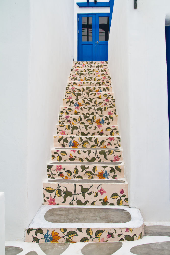 These stairs look like something you'd stumble upon in Greece. It's a shame that more staircases aren't decorated at least a little bit. The same could be said for that fun, blue door! Everything about this entrance is fun,... facebook.com/11476047322399…