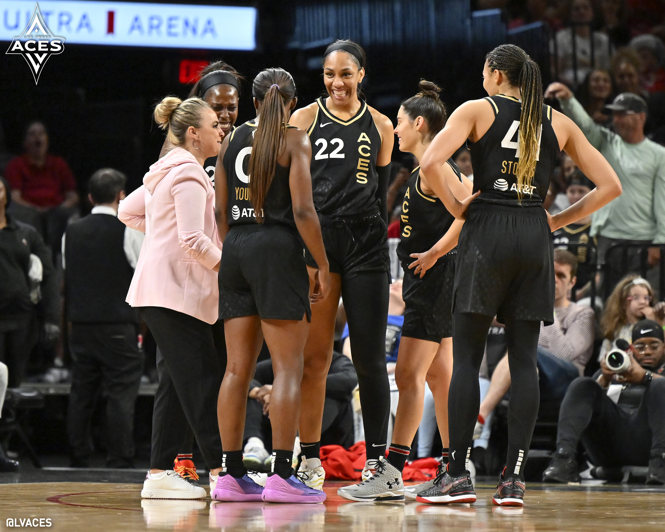 Becky Hammon, Chelsea Gray, A'ja Wilson, Kelsey Plum, and Kiah Stokes in the Las Vegas Aces huddle.