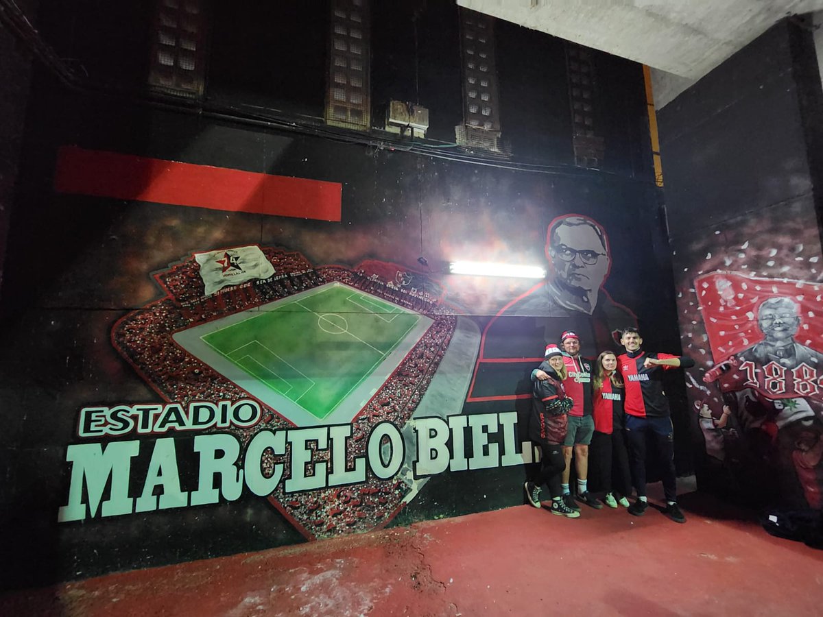 Newells_en's tweet photo. A group of Leeds fans at the Estadio Marcelo Bielsa last night for the Newell's game. 

Some were interviewed by local media in Rosario about the club's relegation. 

They watched as Newell's defeated Godoy Cruz 2-0. https://t.co/dUE0PDL3T3