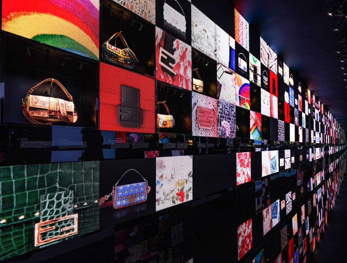 Fendi's tweet photo. Through 16/6, Fendi hosts #FendiHandInHand at Temple in Beijing. To mark the exhibition, Fendi worked with artisans AXiWuZhiMo, head of "Yi Needle Yi Thread", and LeGuShaRi, whose family have been crafting silver jewelry for 14 generations, to create a #FendiBaguette. https://t.co/a9Uk5RMPOj