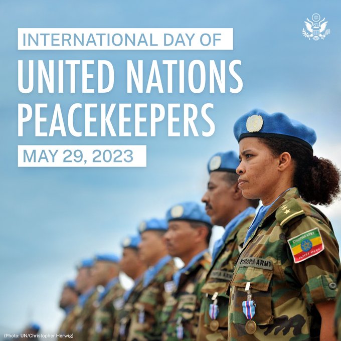UN peacekeepers stand in uniform with the text: "International Nations Peacekeepers: May 29, 2023." Photo: UN/Christopher Herwig. 