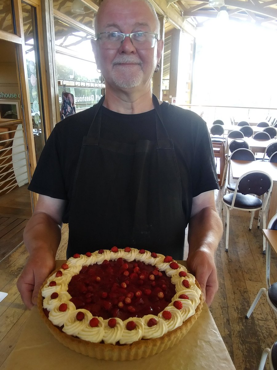 Welshwildlife's tweet photo. Our Head Chef Gareth with one of his mouthwatering creations, a raspberry &amp; lemon tart topped with fresh wild strawberries. A real taste of Summer ! All profits from The Glasshouse Cafe fund our conservation work, so eat well to keep Wales wild ! #WWC #WTSWW #Glasshousecafe https://t.co/4f0aJhxIUb