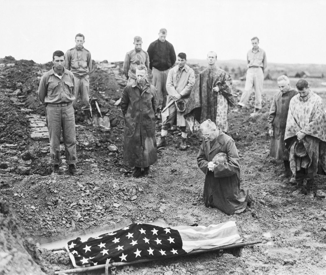 Marine Col. Francis Fenton, a Catholic, kneels beside the flag-draped body of his son, Pfc. Michael Fenton, killed in action in Okinawa. #MemorialDay