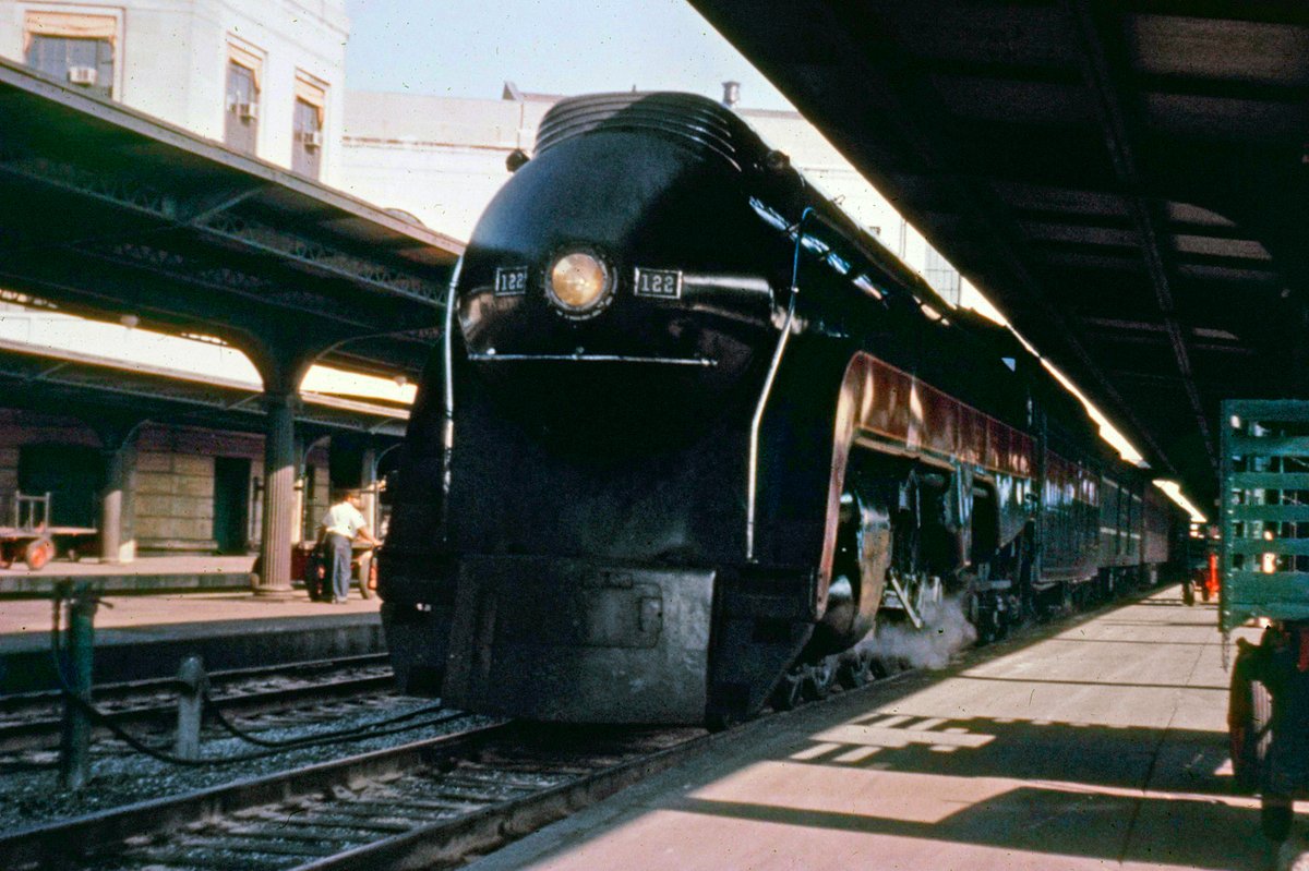 americanrails's tweet photo. Norfolk & Western 4-8-2 #122 (K-2) arrives at Richmond's Broad Street Station during the 1950s. Manufactured by Baldwin in 1923, the K-2s were rebuilt by the railroad during 1945-1946. A handful, like #122, were streamlined; the shrouding closely mimicked the much more famous J's (4-8-4).

https://t.co/j2ec5tkk1M