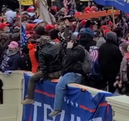 capitolresearc3's tweet photo. @JusticeCat0106 Just noticed that #InfoSprayer is on the phone here, so will try to time this out for the timeline. As usual cannot see who is holding the #BigMediaTowerFlag. The arrested #InfoSprayer is being repped by Alex Jones' personal attorney Norm Pattis - he's clearly somebody. https://t.co/IkZ913nkJy