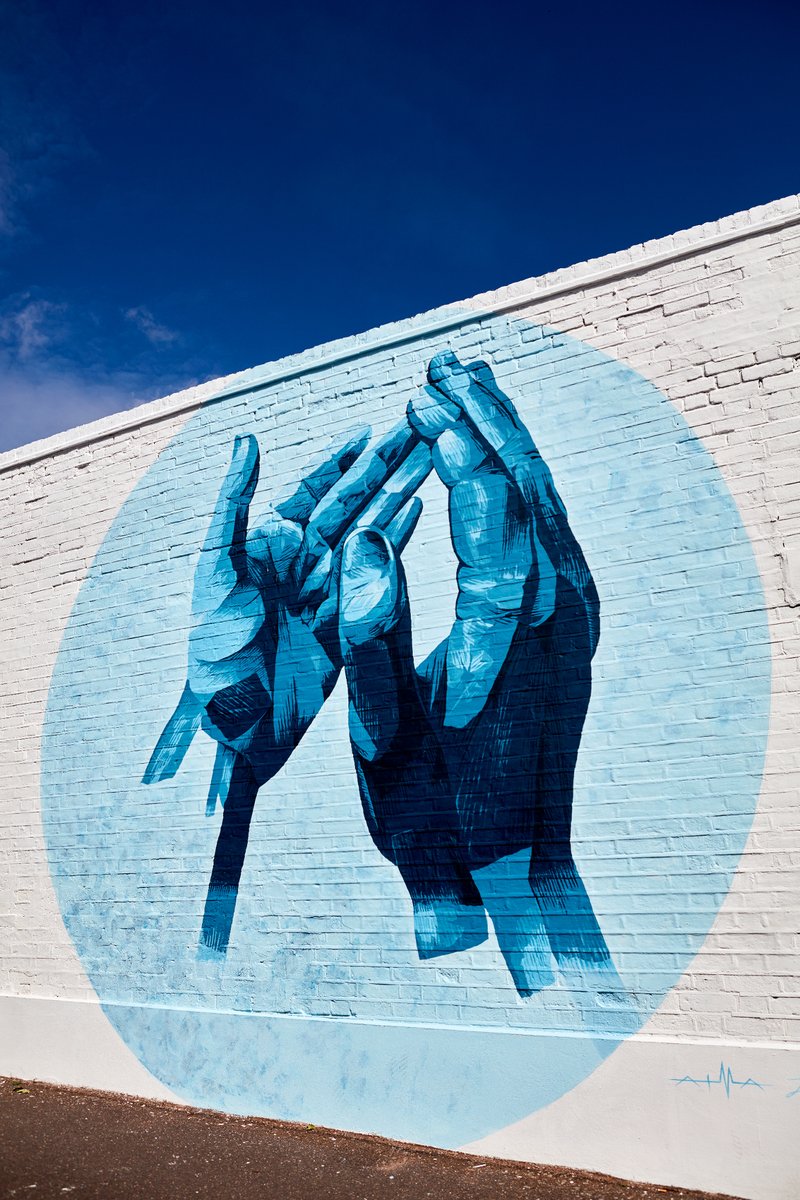 I Clap For by @ianberry_art, 2020

This artwork began as a piece made entirely from denim, Ian's signature style, before becoming a digital piece, a projection all over the country, and then a mural in Walthamstow! 

Painted by (insta: @atmastudio)