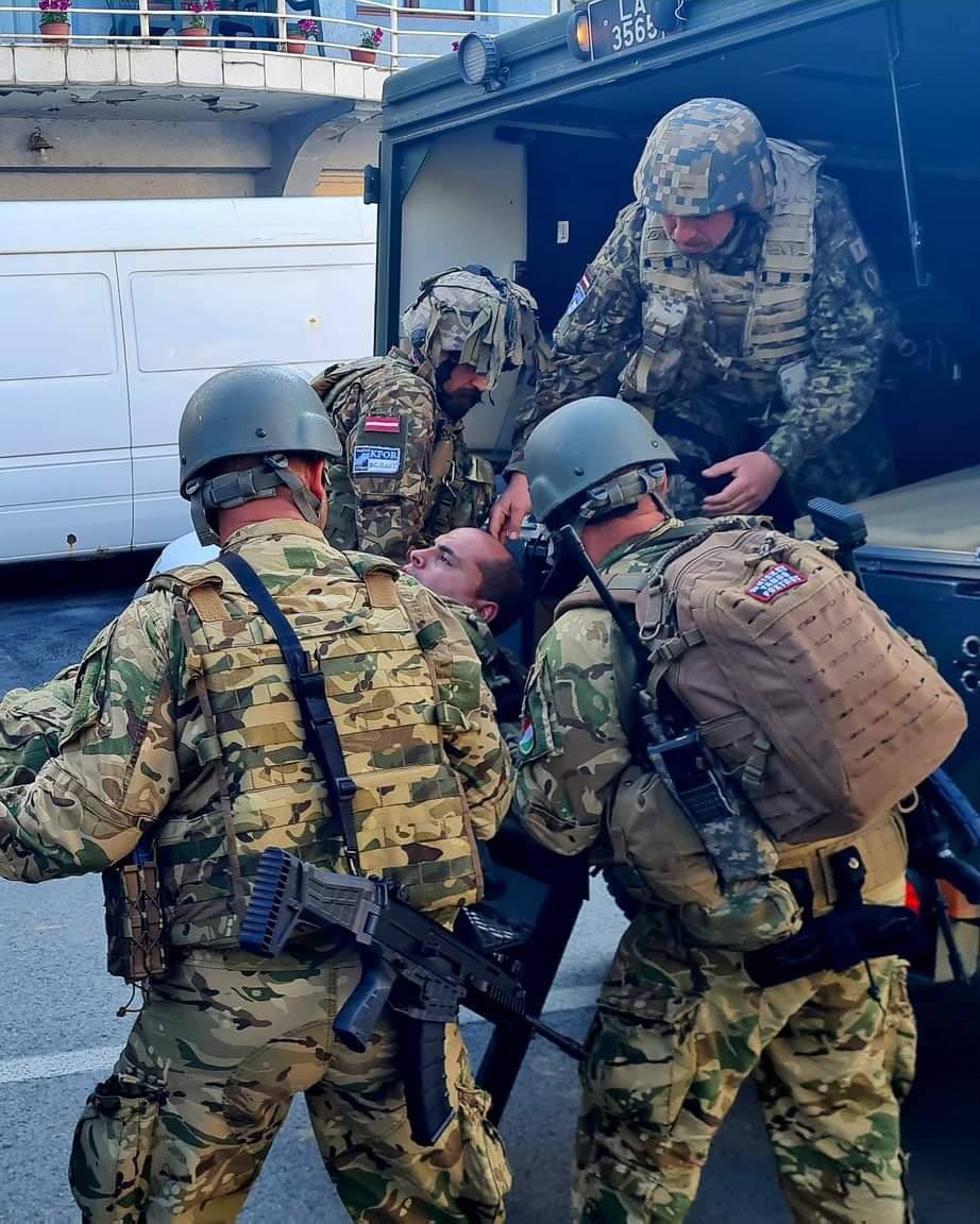 Reporters on the ground say NATO peacekeepers in Kosovo played victim  for Western media after opening fire on Serbian protesters today, some of which are currently in serious condition.

None of the wounded soldiers theatrically taken away appear to have actual injuries up close