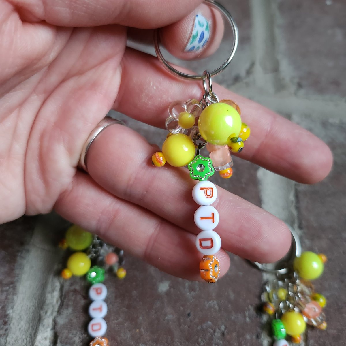 MoonNBack_etsy's tweet photo. 🌼PTD🌼
New PTD song/concert inspired keychains/bag charms have now been added to the shop in our BTS Items section. If you're missing PTD, these keychains are for you. 
Only 3 available. 
https://t.co/OnUiXbUm5b

#PTD #BTS #BTSARMY #handmade #beadedkeychain https://t.co/Hn9igKIVZx