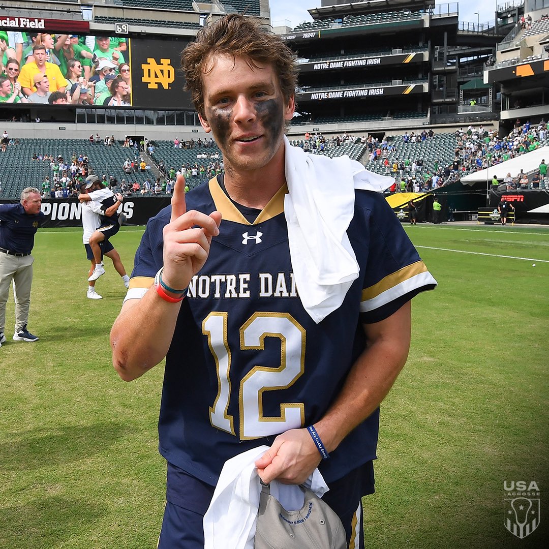USALMag's tweet photo. The captain. The bagpiper. The game-winner. Brian Tevlin is a two-time @ncaalax champion. 👏

Tevlin chose @ndlacrosse for his fifth year, inspired by his late brother.

He hoisted the trophy again on Memorial Day. https://t.co/E7V1DZB6y5