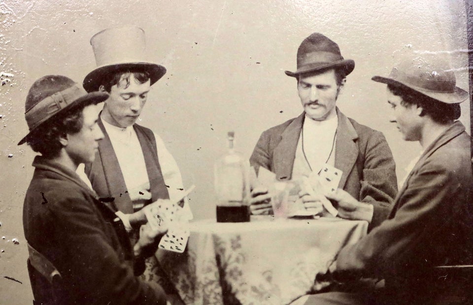 One of only two certified photographs of Billy the Kid (the one with the top hat), playing cards, 1877