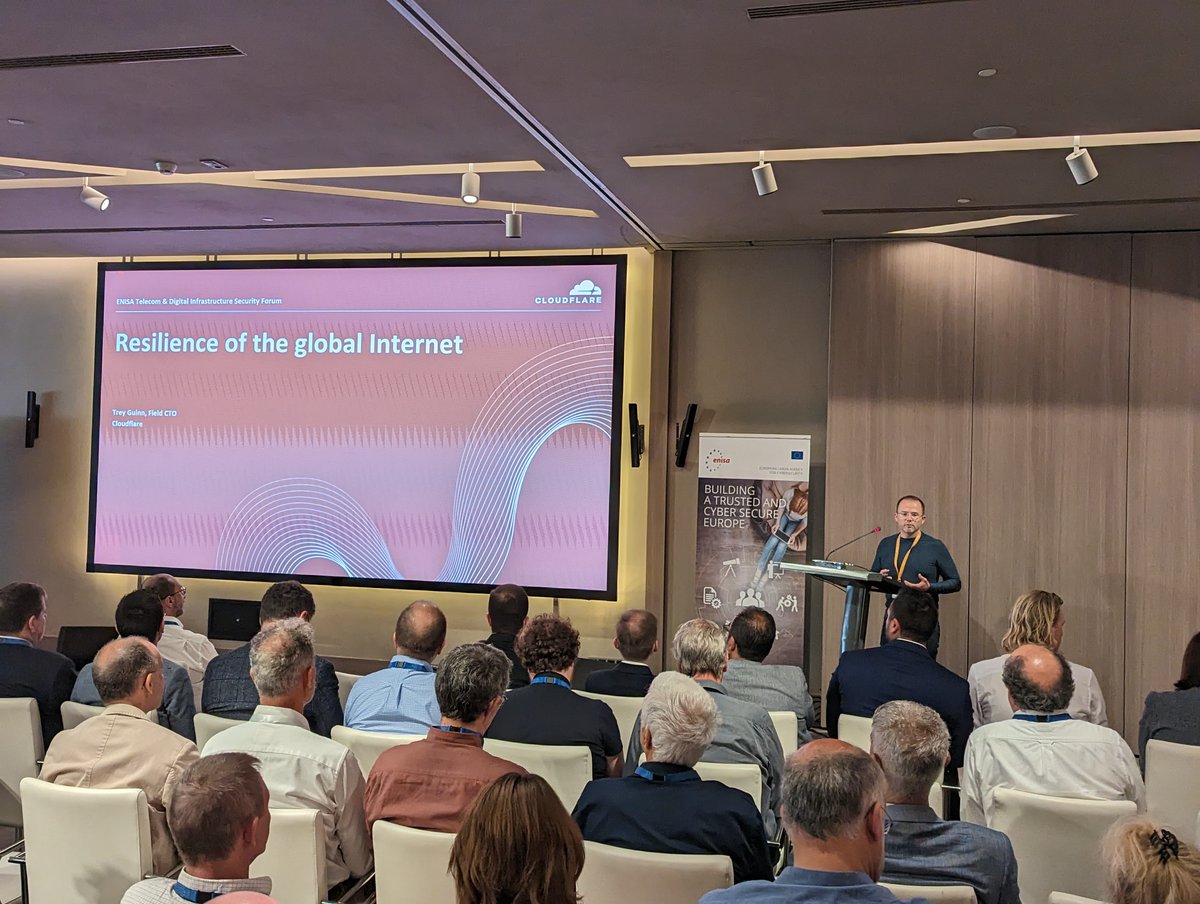 Cloudflare's tweet photo. On May 24, Cloudflare Field CTO @treyguinn spoke about the resilience of the global Internet at the Telecoms &amp; Digital Infrastructure Security Forum in Lisbon. Thank you, @enisa_eu for inviting us to share our vision of a more resilient, secure and privacy-focused Internet! https://t.co/b1GGbjKn7D