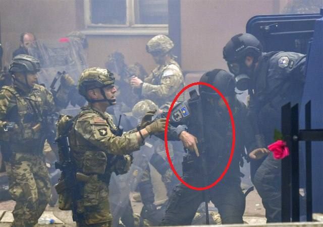 Interesting photo of yesterday's clashes between KFOR 'Peacekeepers' / ROSU 'Special Forces' and Serb peaceful protesters.

101st Airborne member and a ROSU operator with a rifle, which suggests that the claims that ROSU opened fire on Serb civilians are real.