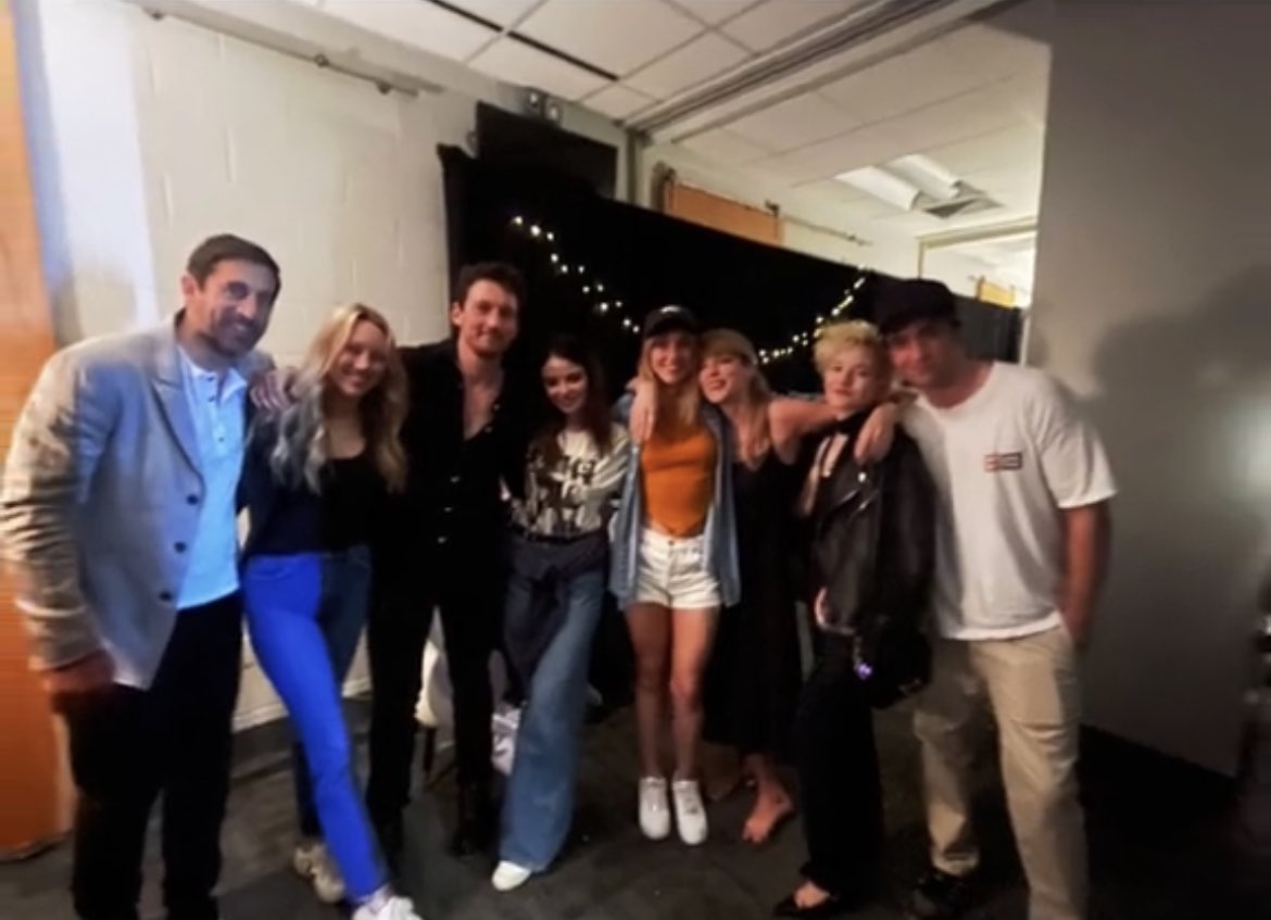 Robert Pattinson, Julia Garner, Suki Waterhouse, Keleigh Teller, Miles Teller, and Aaron Rodgers with Taylor Swift at the #ErasTour 📸