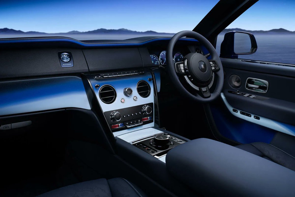 _ppq9's tweet photo. Rolls-Royce’s Cullinan ‘Blue Shadow’ is inspired by the edge of space💙

Rolls-Royce has unveiled a new special edition version of its Cullinan that takes inspiration from the boundary between the Earth and space.

The Black Badge Cullinan ‘Blue Shadow’ has been created to reference the ‘Karman Line’, which is the boundary 62 miles above the Earth’s surface where outer space begins. Just 62 examples will be available worldwide.

At the Karman line, the Earth’s atmosphere resembles a blue ‘halo’ which is why the Cullinan incorporates a range of blue accents. It’s reflected in the painted fascia and door panels, which were created with six layers of paint and five different shades of blue to develop a three-dimensional effect.

There’s also a special ‘Edge of Space’ headliner. A special take on Rolls-Royce’s ‘Startlight Headliner’ – which uses LEDs to create a map of the night sky on the car’s headliner – this setup represents the moon’s surface through special embroidery techniques and the fitment of 1,183 ‘stars’ which are punched in by hand by Rolls-Royce technicians.

A new perforated leather design has also been used for the first time on a Rolls-Royce vehicle. With this setup, the front and rear seats gain a design which is inspired by the view of the Earth from space. It even has ‘clouds’ which are created through perforations in the leather.

As with all other Cullinan models, this special-edition version is powered by a 6.75-litre V12 engine with 563bhp and 850Nm of torque. It’s hooked up to a four-wheel-drive system with four-wheel steering to help make tighter turns easier.