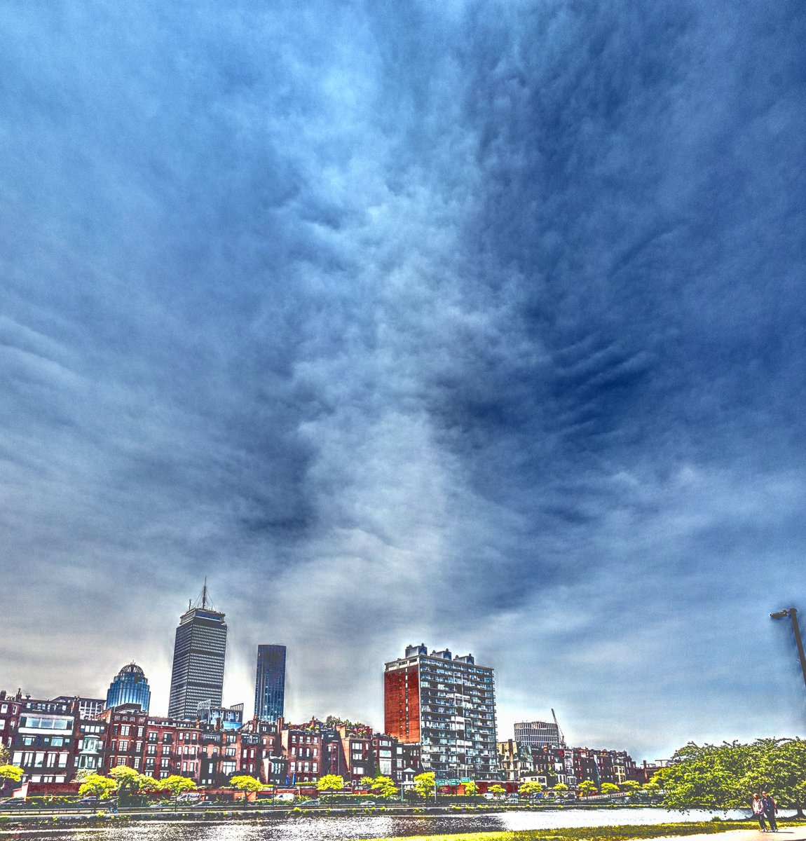 Here's what the arrival of the wildfire smoke from the southeast looked like in Boston at 11:45 a.m. as watched from the Esplanade. I did not retouch any of the individual elements in the photo, I boosted the overall tones and saturation in the image to enhance what was going on…