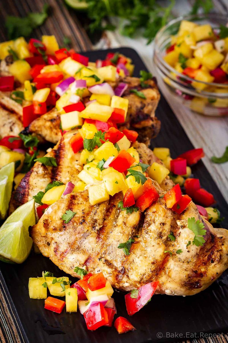 This lemon garlic grilled chicken with pineapple salsa is quick and easy to make and is the perfect summer meal! Juicy grilled chicken with fruit salsa! Get the recipe: bake-eat-repeat.com/lemon-garlic-g…