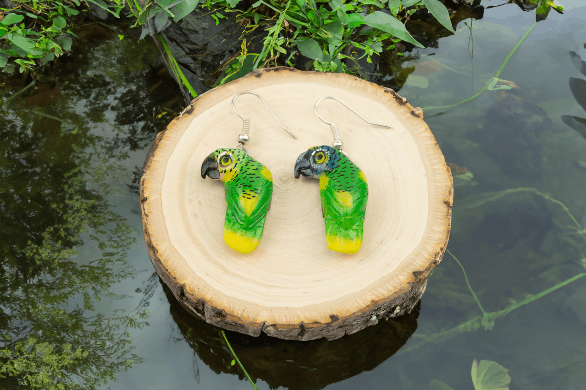 Parrot Tagua Earrings. Handcrafted from the eco-friendly Tagua nut, Perfect for bird lovers or anyone who appreciates fun, whimsical style. Tap to shop now. #TraderBrock #TaguaEarrings #SustainableFashion #Panama'