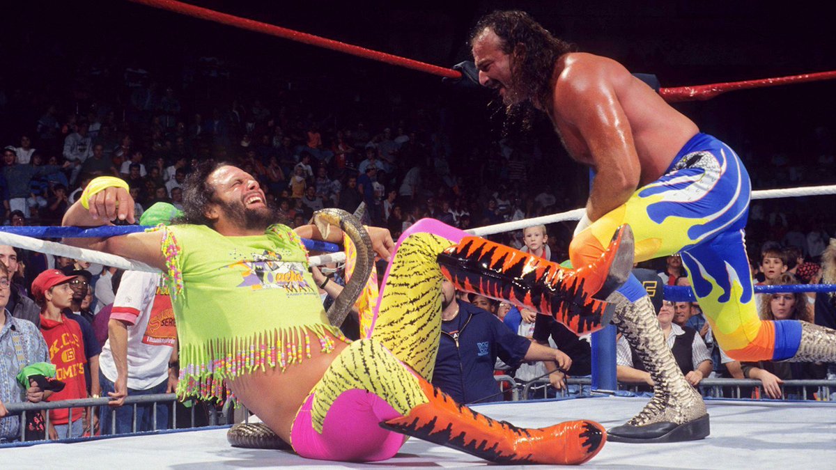 🎥 Federation Flashback! A shocking image as Jake Roberts unleashes a king cobra on the prone 'Macho Man' Randy Savage... Holy mackerel! October 21, 1991. 🐍 #WWF #WWE #Wrestling #RandySavage #JakeRoberts