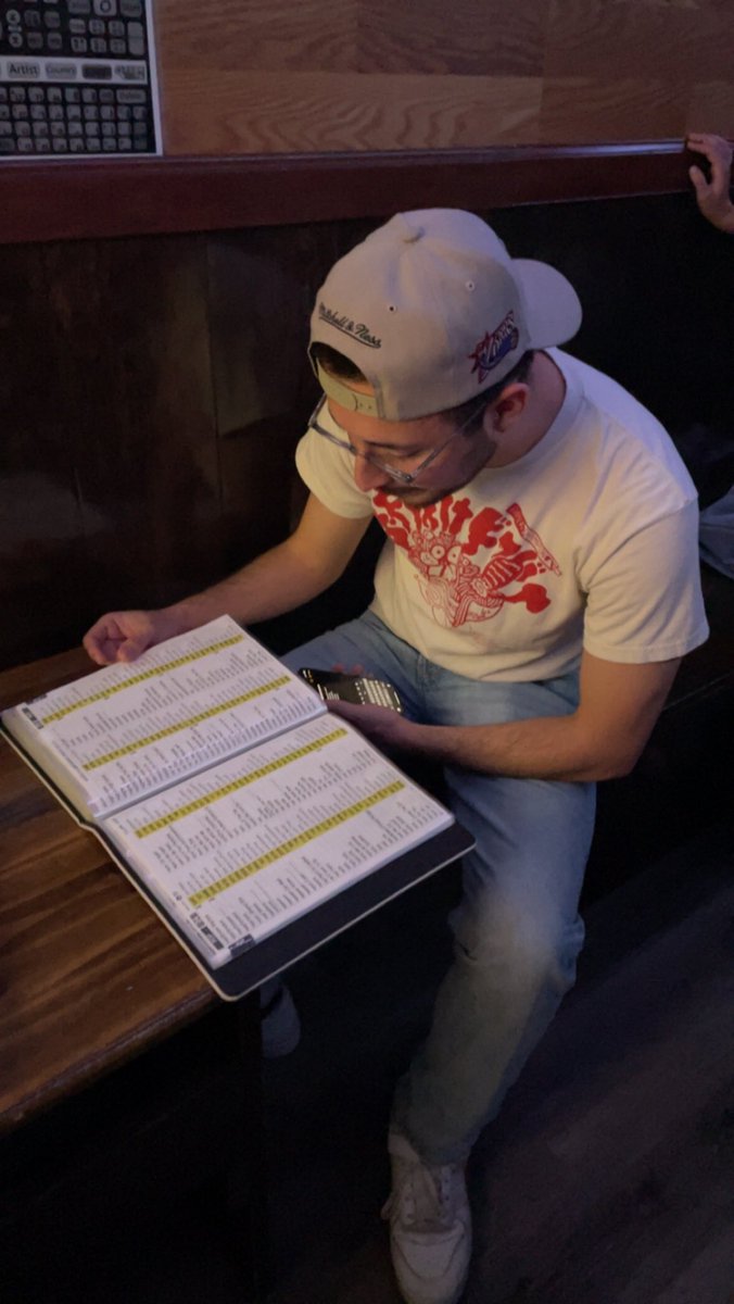 Poring over the ancient texts (picking a karaoke song)