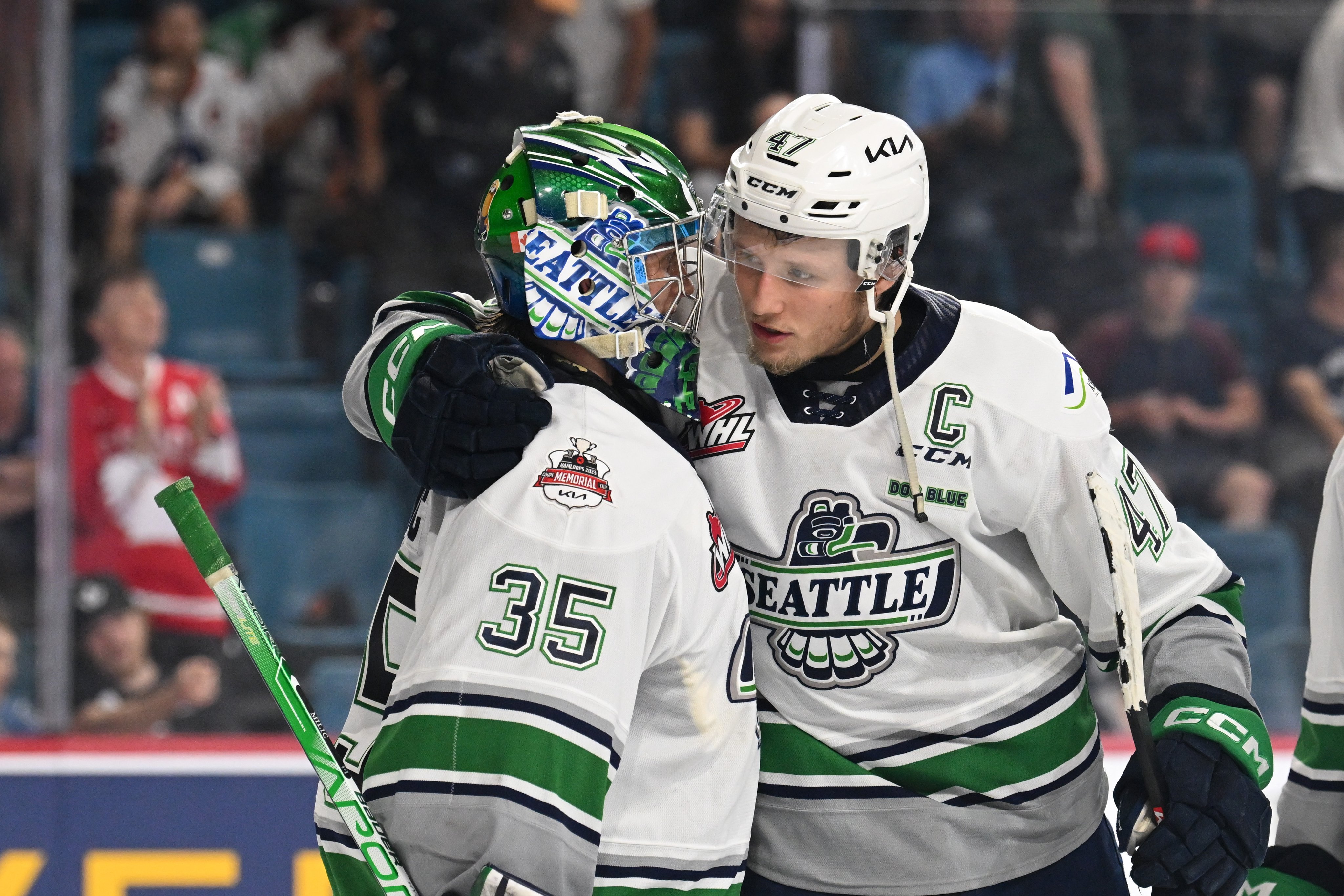 Seattle Thunderbirds - Cool Bird poses with a young fan.