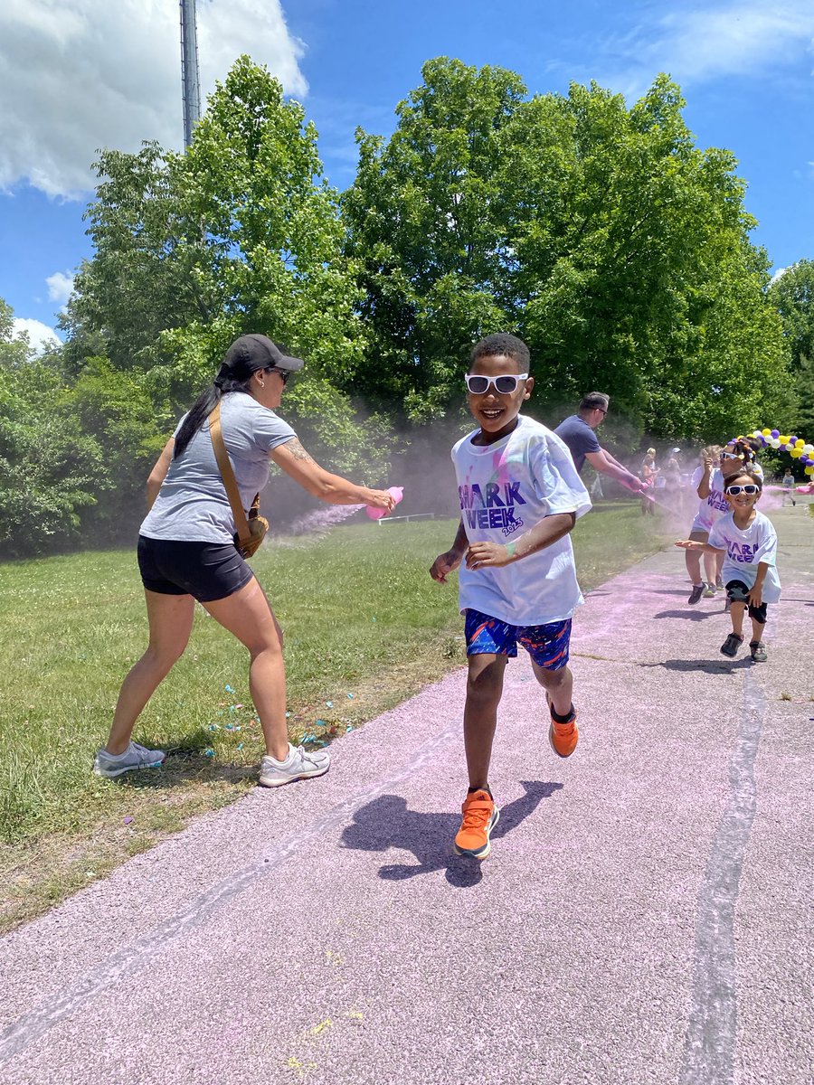 MrsJacksonAP's tweet photo. We kicked off 💜🦈Shark Week🦈💜 with a Color Run @StopherSharks! Sunshine, color blasts, lawn games, and popsicles. Thanks to our volunteers for making it happen. #DynamicStopher @MelissaLShearon https://t.co/tTuBcpoaAy