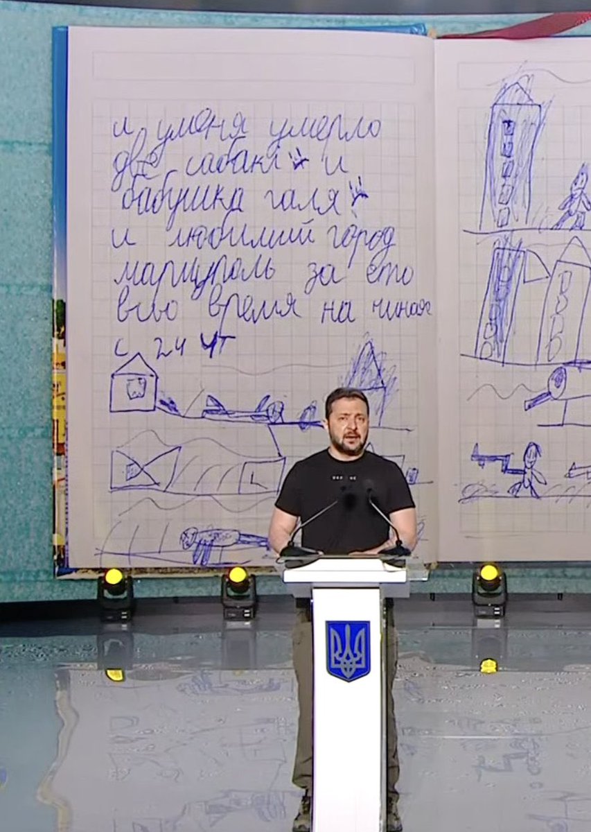 reshetz's tweet photo. Zelensky reading a diary of a child from Mariupol 

“My two dogs died, and my grandma Halya also died, so did my dear city Mariupol through this time since thursday 24th” https://t.co/W8zKjyLaF4