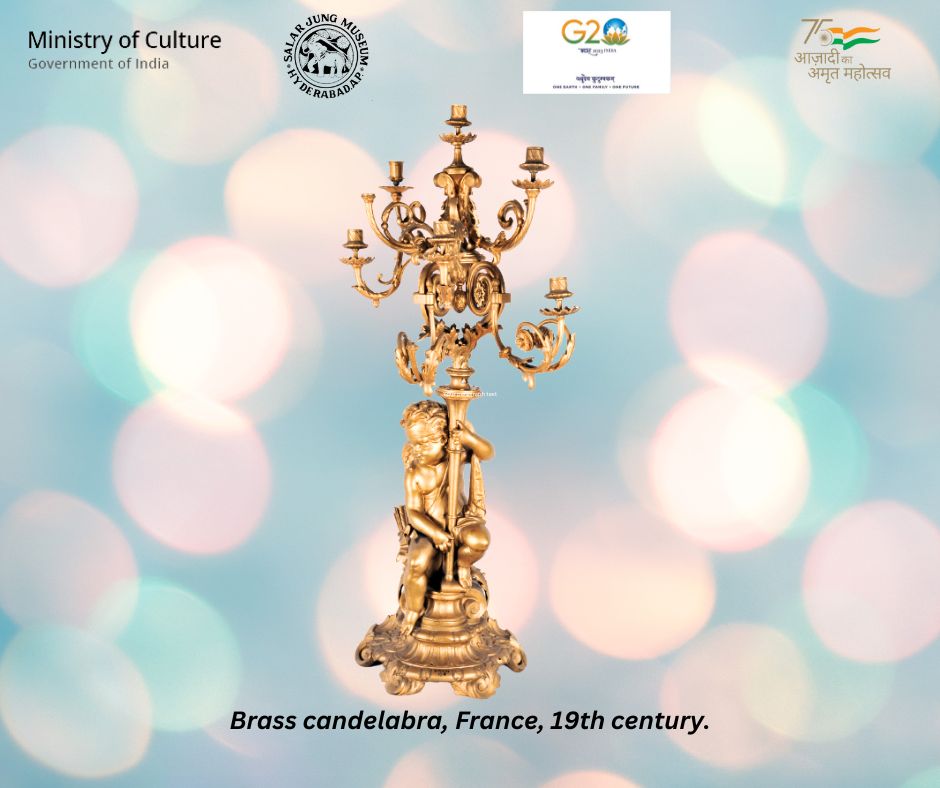 sjmhyd's tweet image. An interesting brass candelabra of nine candle holders with acanthus leaves and fruit motifs, a cupid holds the candelabra on his left side, from France, dated to the 19th century.
#SalarJungMuseum #Candelabra #AmritMahotsav
