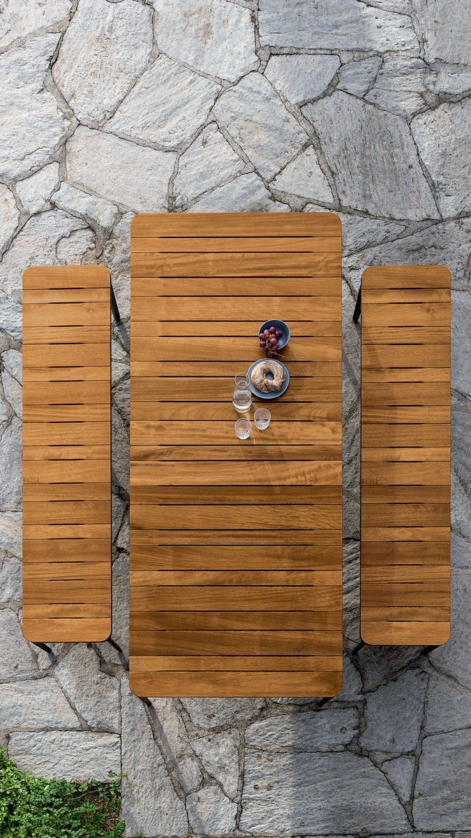 The slats of different widths, arranged in a regular pattern, become a design detail in Slim #outdoor table collection. #sovet #livingoutdoor