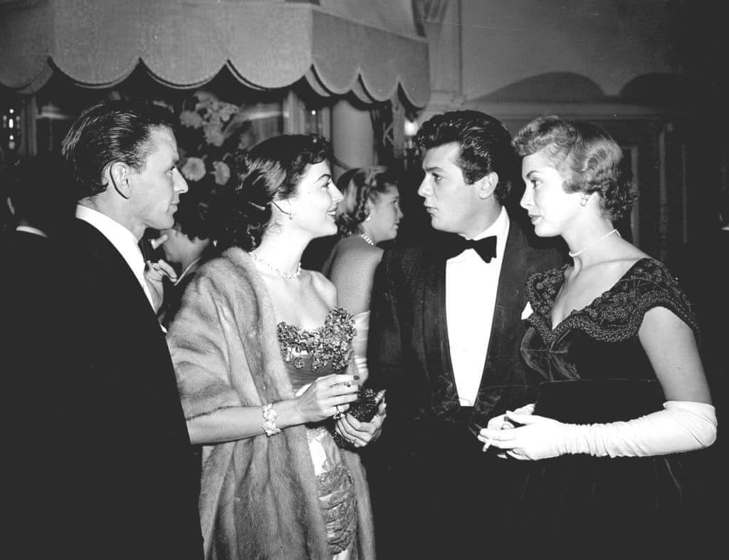 Frank Sinatra, Ava Gardner, Tony Curtis and Janet Leigh attend a dinner at the Empress Club, London, December, 1951