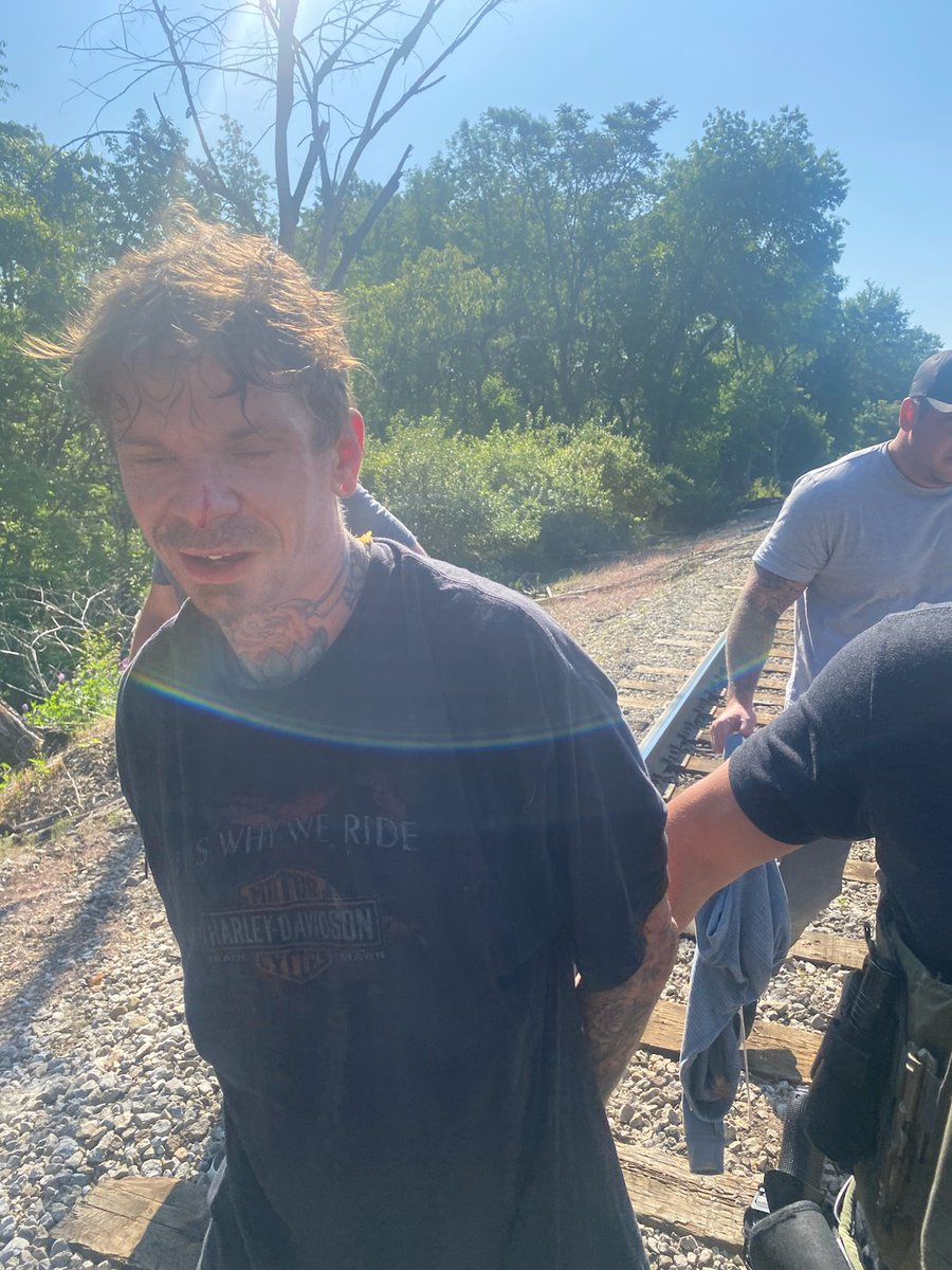 JUST IN: Photo of inmate escapee Jason Conrad as he's taken into custody by US Marshals this morning on the train tracks along Arlington Rd in Akron @wkyc