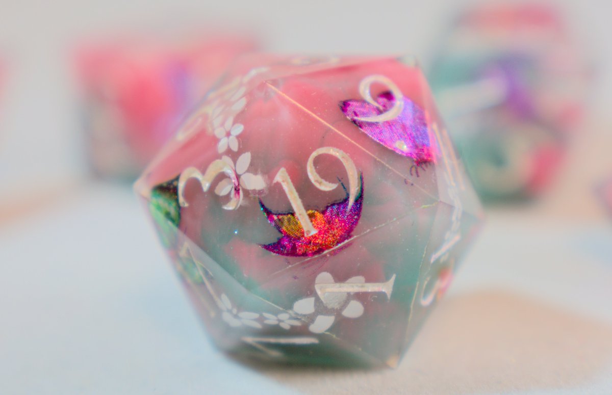 This set, "Butterfly Kisses," is absolutely my favorite set I've made recently.

Pick them up on the website: dragonknightdice.com/product-page/b….