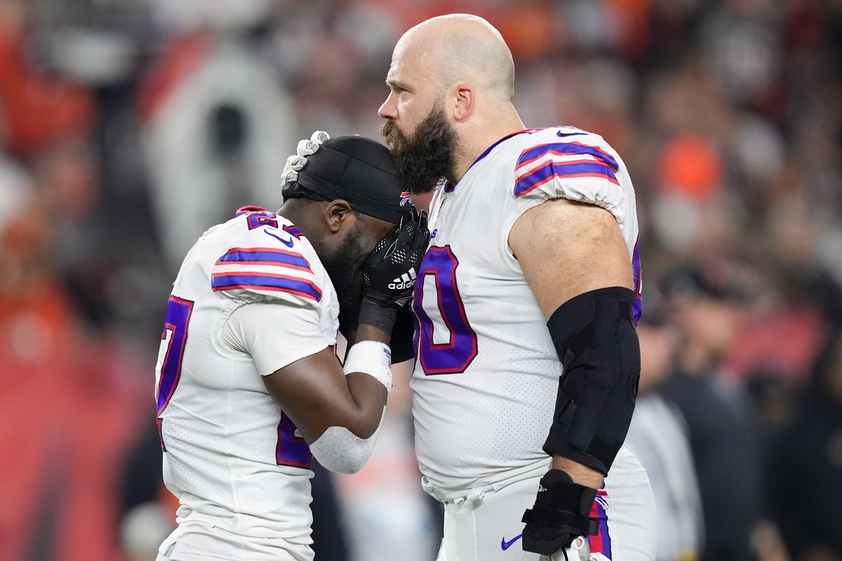 In the Hall of Fame's annual Photo Contest, judges have picked the Dave Boss Award of Excellence winner. Dylan Buell's entry, 'Comfort', shows Mitch Morse & Tre'Davious White a short distance from where Damar Hamlin received life-saving aid. Full Story: profootballhof.me/BossAward