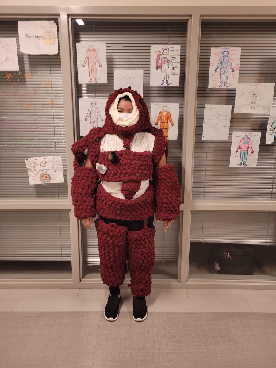 Astronomy Class: Mrs. Rock did design a space suit project during the last six weeks of school. One of her students took it to a whole new level. Emiko Bravo crocheted a space suit and several students even tried it on.