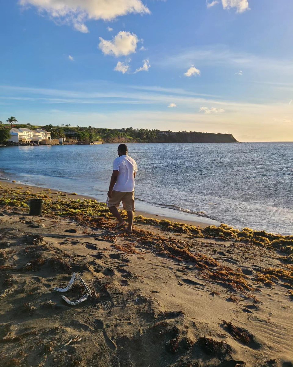 My cousin, walking the black sand beaches of our village, Dieppe Bay.