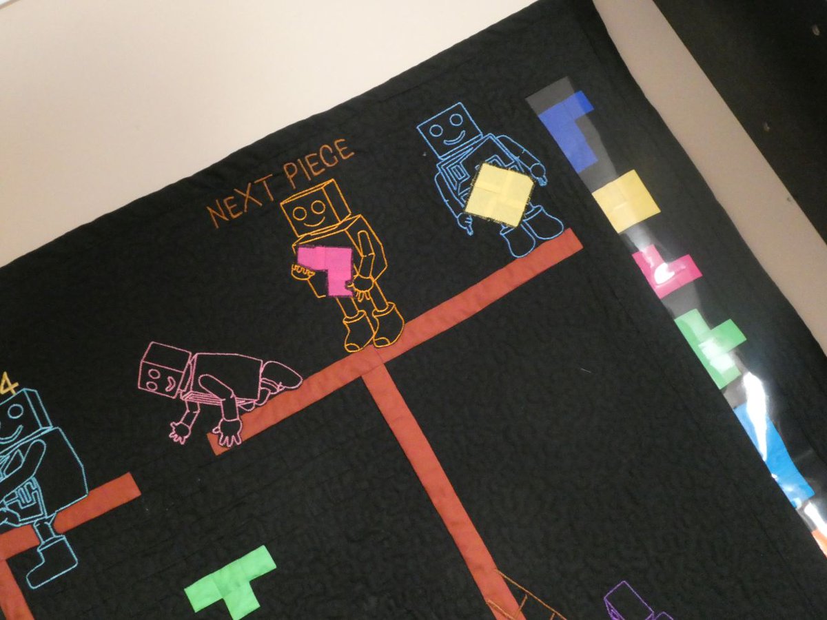 SusanBluerobot's tweet photo. Here is my latest quilt i have made. I designed the robot in blender 3d, posed it into the way i wanted them then took the photos into embroidery software and turned them into robots i could sew out on the embroidery machine https://t.co/WHtGuhIr3T