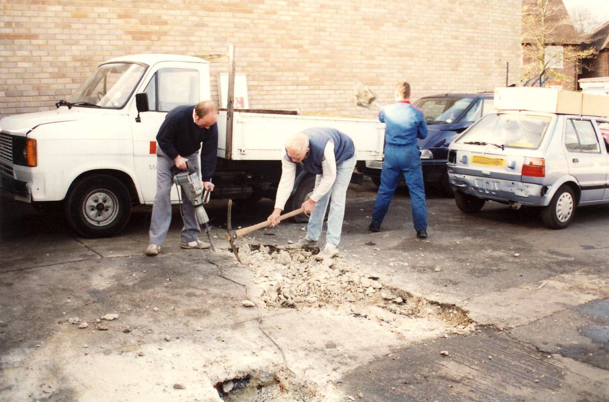 Talk about hands-on dedication! 💪⚒️ Peter Laney with his uncle in early 90s breaking ground of what would become our Reception area for over 20 years.

#Throwbackthursday #HL70years #HandLMotors