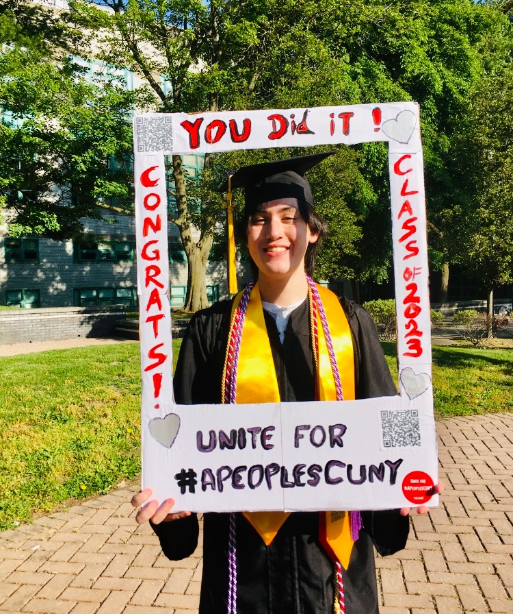 Congrats and happy commencement to Peter Mainetti (pictured here) and to all QC 2023 grads! 

Help us fight for the next generation. 
psc-cuny.org/classof2023 

 #FullyFundCUNY #FundCUNY  #APeoplesCUNY #FixCUNY #FreeCUNY #InvestInCUNY #NewDeal4CUNY #CareNotCuts