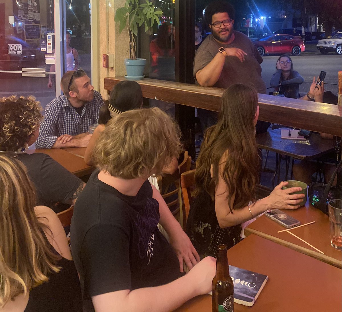 justin_karcher's tweet photo. Last night was wild. We had poets everywhere. They were reading poems through open windows &amp; climbing over chairs. The vibe was good, the air was hot, there were tears of sadness &amp; tears of joy. Big thx to @Pureinkpoetry for featuring. We’re back again in two weeks. Love you all https://t.co/i0Xsl3VjwR
