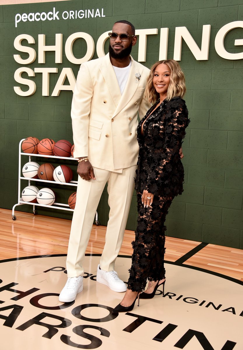 GQSports's tweet image. .@KingJames and Savannah James at the #ShootingStars premiere