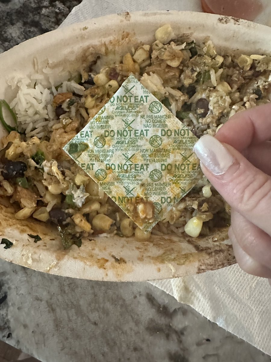 taylorwynn's tweet photo. @ChipotleTweets I was reheating my bowl and found this INSIDE at the bottom of the bowl…. what is this and why is it in the food? https://t.co/1I5UPbFy0x