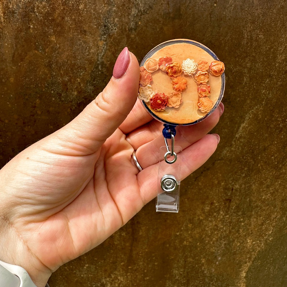 ROSC Collection - featuring Credentials in Burnt Orange. 🔸 Non medical and new colors OTW 🔸 #nurse #physicaltherapy #occupationaltherapy #rn #pt #ot #healthcare #badgereel #clayflowers #polymerclay #flowerart #medicalfield #resin #smallbusiness #smallbizowner #smallbiznc #ws